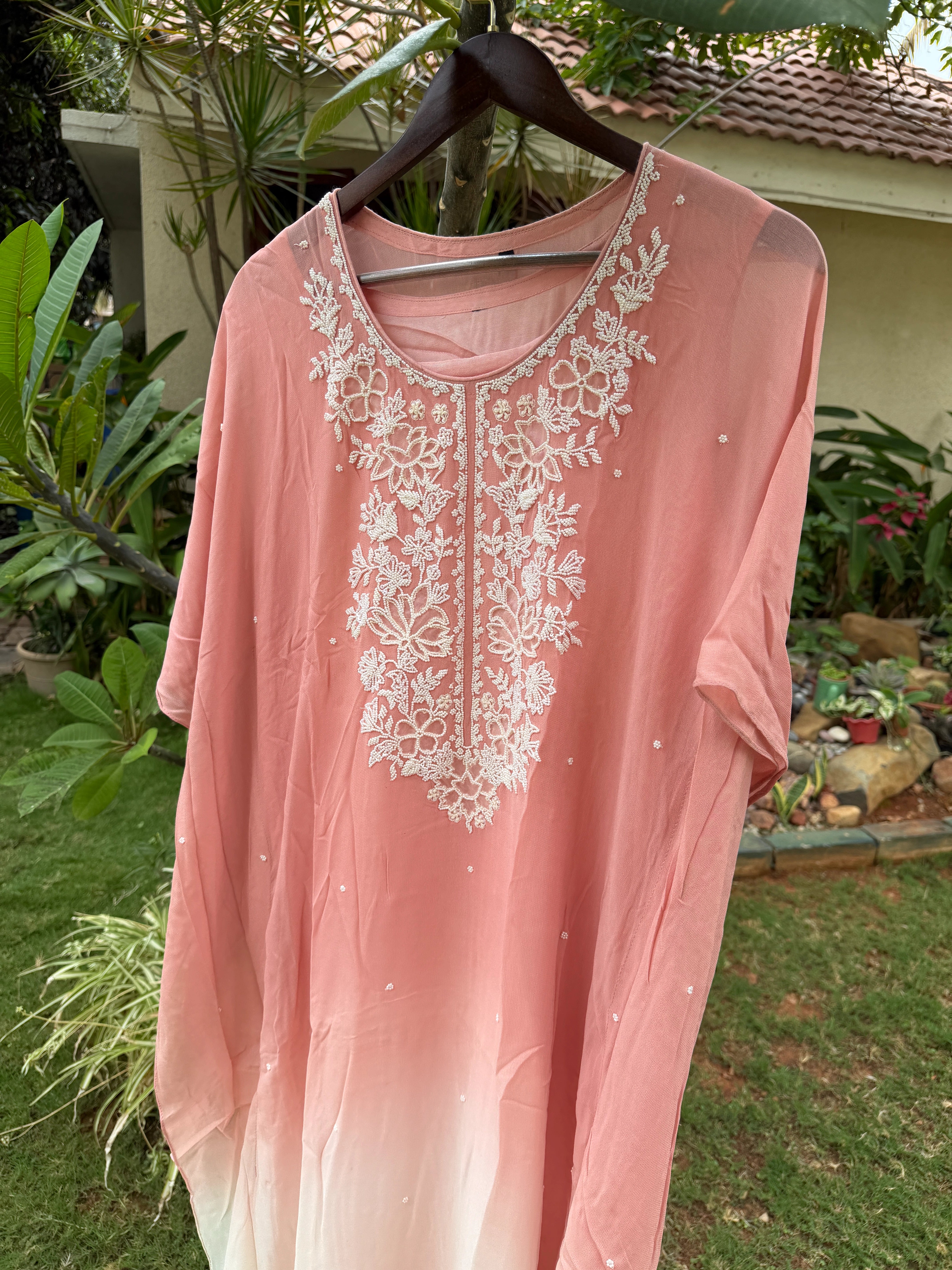 This Draped ensemble paired  Kaftan Set