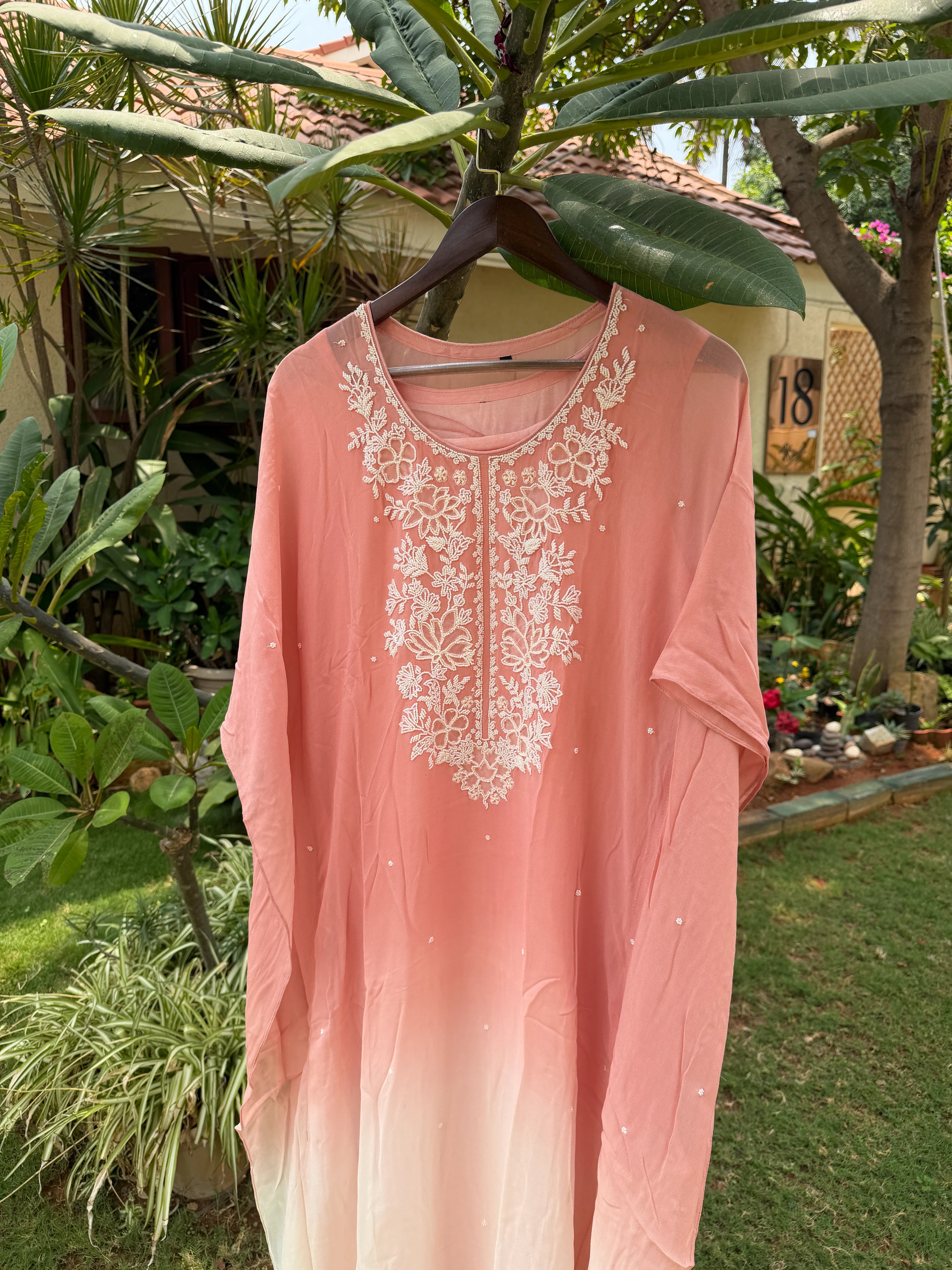 This Draped ensemble paired  Kaftan Set